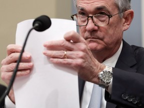 Federal Reserve Board Chairman Jerome Powell prepares his testimony as he waits for the beginning of a hearing before the House Budget Committee November 14, 2019 on Capitol Hill in Washington, DC. The committee held a hearing on "The Economic Outlook: The View from the Federal Reserve."