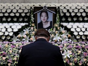 A man pays tribute at a memorial altar honouring K-pop star Goo Hara at the Seoul St. Mary's Hospital on Nov. 25, 2019 in Seoul, South Korea. K-pop star Goo Hara of Kara was found dead the previous day.