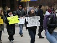 About 30 students gathered outside the University of Windsor's CAW Centre on Wednesday, November 6, 2019 to protest cuts to education put forward by the Doug Ford Progressive Conservatives.