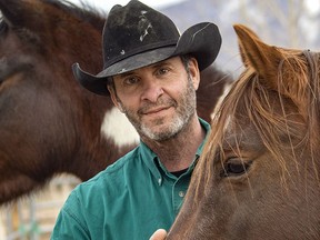 Retired NHL player Clint Malarchuk is seen with a horse in this submitted photo.