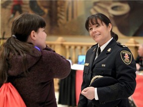 Windsor Police Chief Pam Mizuno, right, speaks with Cheyanne Moore, 15, of Westview Freedom Academy during Build a Dream's career discovery expo at Ciociaro Club of Windsor Thursday.