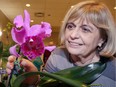 Sheila Doiron-Csabai admires one of her orchids during Essex County Orchid Society's 10th Anniversary Orchid Show & Sale at Visitation Parish Hall 5407 Comberside Rd. N., Comber.  Orchids in three categories; Amateur, Society and Vendors were judged Saturday morning, then displayed for the public, Saturday afternoon.