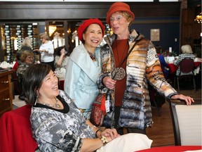 Guests Betty Lee-Daigle, left, and Catherine Fung chat with model Sue Rousseau, right, during WSO Guild's Fall Fashion Show held at Beach Grove Golf and Curling Club Wednesday. Funds raised go towards WSO Outreach and Education programs, the Windsor Symphony Youth Orchestra, and the WSOG Scholarship for young musicians part of the WSYO.  Models were wearing designs from A La Mode Boutique.