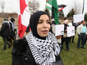 Windsor, Ontario November 23, 2019 -  Maryam Farag of the local Palestinian Solidarity Group speaks to the media about issues during a protest on Huron Church Road at College Avenue, Saturday.