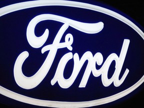 (FILES)The Ford Motor Company logo is seen in this November 18, 2008 file photo at a dealership in Fairfax, Virginia.  Ford Motor shares tumbled more than six percent on December 18, 2013 after the company forecast disappointing 2014 profit and said its mid-decade profit margin target was at risk.