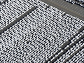 New cars of German car maker Volkswagen (VW) stand ready for shipping next to the Volkswagen plant in Emden, northwestern Germany, on September 30, 2015.