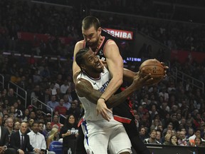 Toronto Raptors center Marc Gasol (33) fouls LA Clippers forward Kawhi Leonard (2) as he looks to shoot during the first half at Staples Centeron Monday night. : Richard Mackson-USA TODAY Sports