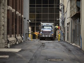 The alley adjacent to the Windsor Armouries - School of Creative Arts in downtown Windsor gets paved, Friday, Nov. 22, 2019.