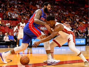 Miami Heat forward Jimmy Butler knocks the ball from Detroit Pistons centre Andre Drummond during the first half at American Airlines Arena.