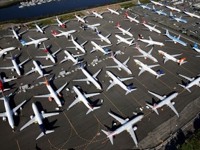 FILE PHOTO: Dozens of grounded Boeing 737 MAX aircraft are seen parked in an aerial photo at Boeing Field in Seattle, Washington, U.S. July 1, 2019. Picture taken July 1, 2019.