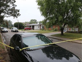 Police tape surrounds the front of a home in the 2600 block of Jefferson Blvd. on Thursday, August 17, 2017.