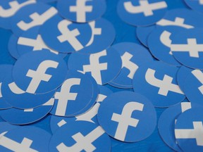 FILE PHOTO: Stickers bearing the Facebook logo are pictured at Facebook Inc's F8 developers conference in San Jose, California, U.S., April 30, 2019.