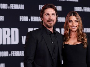 Cast member Christian Bale and his wife Sibi Blazic pose at a special screening for the movie "Ford v Ferrari" in Los Angeles November 4, 2019. (REUTERS/Mario Anzuoni/File Photo)