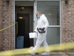 A Windsor police investigator at a homicide scene at 591 Wellington Ave. on May 28, 2019.