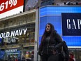 Pedestrians walk past Old Navy and Gap stores in Times Square, March 1, 2019 in New York City. (Drew Angerer/Getty Images)