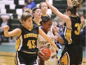 Kennedy Clippers' Alisha Murray, centre, is pressured by Brynlee Ammonite, left, and Lexi Dodds of General Amherst during Sunday's WECSSAA senior girls' AA basketball final at the St. Clair SportsPlex.