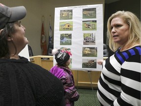 The Town of Tecumseh hosted a public information centre on the urban hen pilot program on Wednesday, November 20, 2019, at the town hall. Jennifer Alexander, right, deputy clerk manager legislative services speaks with Karen Nagy and her daughter Falynn, 7, who are looking into getting some chickens.