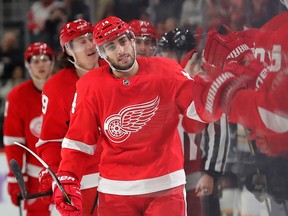 Detroit Red Wings center Robby Fabbri celebrates with teammates after scoring in the first period against the Boston Bruins at Little Caesars Arena.