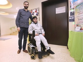 Ahmad Bazzi, left, and Mohamad Nadi, members of the youth group at the Imam Hussain Foundation, are shown Nov. 15, 2019. They are helping raise money for a new elevator at the community centre, where the existing one was deemed unsafe over two years ago.