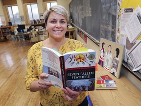 April Roy, the head of the English department at the Walkerville Collegiate Institute in Windsor is shown with one of the Indigenous books her students are studying.