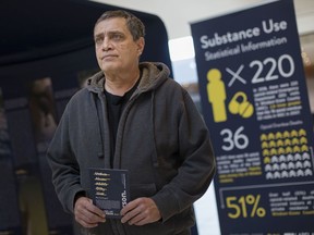 Derek Khan, a recovering drug addict, helps out at the Label Me Person Anti-Stigma Awareness Campaign at Devonshire Mall on Nov. 8, 2019.