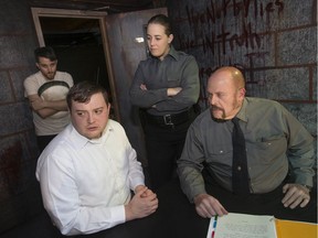 Katurian, played by Eric Branget, centre-left, is interrogated by detectives Ariel, played by Fay Lynn, and Tupolski, played by Simon Du Toit, while Michal, played by Joey Wright, looks on, while on the set of The Pillowman at the Shadowbox Theatre, Tuesday, Nov. 19, 2019.  The play opens this Friday, November 22.