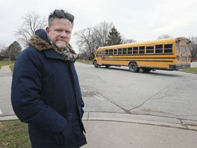 "A real problem." Christopher McNamara, shown Nov. 28, 2019, at the intersection of Little River Boulevard and Grace Road in Tecumseh, says it's not fair that school buses no longer allow students to bring onboard any items too big to fit in a backpack.