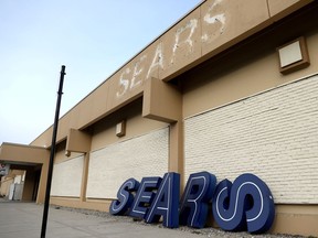 FILE PHOTO: A dismantled sign sits leaning outside a Sears department store one day after it closed as part of multiple store closures by Sears Holdings Corp in the United States in Nanuet, New York, U.S., January 7, 2019.