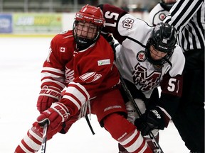 Leamington Flyers' forward Thomas, at left, is seen in action against Chatham. Michaud was one of seven players traded by the Flyers in an effort to get players on the ice.