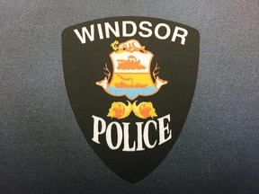 Windsor Police Service insignia on a backdrop at headquarters.