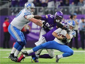 David Blough of the Detroit Lions gets sacked by Everson Griffen of the Minnesota Vikings in the fourth quarter at U.S. Bank Stadium on December 8, 2019 in Minneapolis, Minnesota. The Minnesota Vikings defeated the Detroit Lions 20-7.