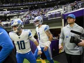 David Blough #10, Kyle Sloter, and Matthew Stafford of the Detroit Lions take the field before the game against the Minnesota Vikings at U.S. Bank Stadium on December 8, 2019 in Minneapolis, Minnesota.