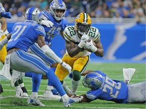 Dexter Williams of the Green Bay Packers runs for a first down during the second quarter of the game against the Detroit Lions at Ford Field on Dec. 29, 2019 in Detroit, Michigan.