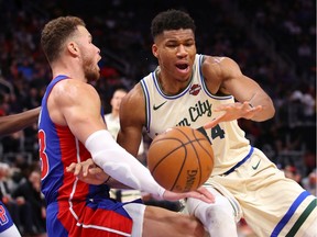 Giannis Antetokounmpo of the Milwaukee Bucks drives to the basket against Blake Griffin of the Detroit Pistons during the second half at Little Caesars Arena on December 04, 2019 in Detroit, Michigan. Milwaukee won the game 127-103.