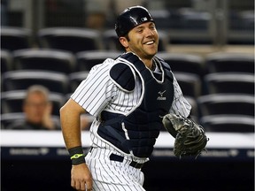 NEW YORK, NY - MAY 17:  Austin Romine #53 of the New York Yankees celebrates the win after he made the final catch for the out against the Toronto Blue Jays on May 17, 2013 at Yankee Stadium in the Bronx borough of New York City.The New York Yankees defeated the Toronto Blue Jays 5-0.