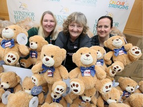 The Calendar Club owner Dorothy Ladouceur, centre, along with her daughter Charlene Ladouceur and Jen Burton-Liang, right, a child life worker in Paediatrics, are surrounded by 1,400 Teddy Bears at Windsor Regional Hospital Met Campus Wednesday.  Dorothy Ladourceur along with hundreds of customers, arranged to purchase the bears and haul them to Met Campus for children having surgery and procedures.