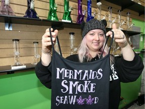 Hempstarz Cannabis Co. co-owner Emily Boyle displays merchadise at the new business located on Sandwich Street Saturday.
