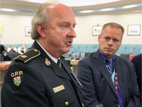 OPP Insp. Glenn Miller, left and Robert Moroz, integrated director of community mental health, Hotel-Dieu Grace Healthcare, announce a front-line collaborative effort to help with the mental health and addictions crisis Tuesday.