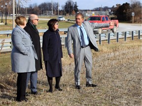 Greater Essex County District School Board superintendent of education, school development and design, Todd Awender, right, gestures to board officials Shelley Armstrong, left, Erin Kelly and Ron LeClair on a 25.1-acre parcel of land on Jasperson Lane, near the Kingsville Arena, on Wednesday, Dec. 18, 2019.
