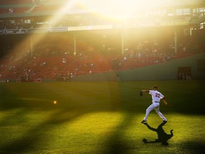 Rick Porcello of the Boston Red Sox warms up in centre field before the game against the Oakland Athletics at Fenway Park on May 11, 2016 in Boston, Massachusetts.