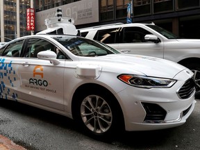 FILE PHOTO: An Argo Ai self driving prototype vehicle is seen outside a Ford and Volkswagen joint news conference in New York City, New York, U.S., July 12, 2019.