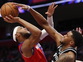 Detroit Pistons guard Bruce Brown is guarded by San Antonio Spurs forward Rudy Gay during the second quarter at Little Caesars Arena.