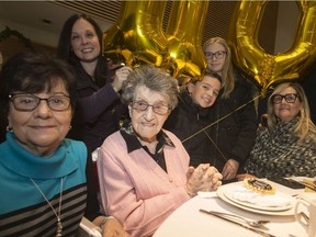 Olinda Mascarin, centre, celebrates her 110th birthday surrounded by family while at a Christmas party at Huron Lodge, Wednesday, Dec. 4, 2019.