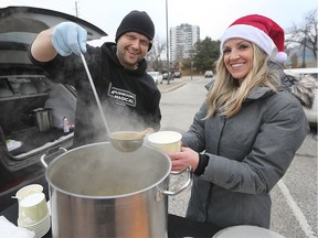 Windsor lawyer Helen Burgess was spreading some Christmas spirit on Tuesday, December 24, 2019 as she and other volunteers set up at the corner of University and Bruce and handed out hot soup and essential clothing. Denis Vidmar from the Magical Mushroom Hub provided the soup and is shown with Burgess during the event.