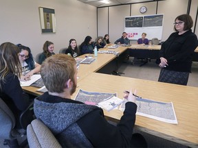 The EcoTeam from Leamington District Secondary School held a Climate Action Summit on Tuesday, December 10, 2019 at the Essex Civic Centre. Tammie Ryall, right, director of community and development services with the municipality of Lakeshore speaks with Belle River High School students about their environmental concerns during the event.