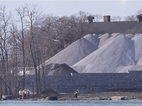 Officials with various U.S. agencies inspect the site of a shoreline collapse into the Detroit River that was suspected of being contaminated,  Friday, December 6, 2019.