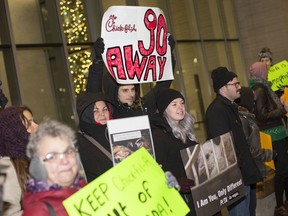 Activists protest the proposed location of a Chic-Fil-A in Windsor, while outside City Council, Monday, December 2, 2019.