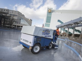 Pat Manzone, from the Parks and Rec Department, floods the newly laid ice at Charles Clark Square, Wednesday, Dec. 11, 2019.  Wednesday was the fist day cold enough to start building the skating rink.