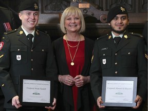 WINDSOR, ON. DECEMBER 3, 2019 -- ENWIN presented three post-secondary education scholarships to soldiers from the Windsor Regiment Association on Tuesday, December 3, 2019, at the Tilston Armoury. Cpl Noah Tardiff, left, and Cpl Ahmed Al-Hayawi each received a $500 scholarship from Barbara Peirce Marshall, Manager, Corporate Communications & Public Relations Strategy with ENWIN. Cpl Brandon Cabagay who also received a $500 scholarship was not able to attend the photo op.