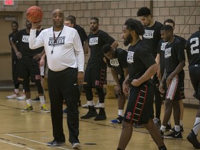 Windsor Express head coach, Bill Jones, at left, leads the first practice of the season at the Constable John Atkinson Memorial Community Centre, on Monday as training camp opened.